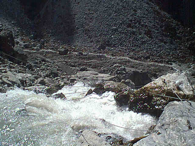 Water dropping from notch to join Rolwaling River below